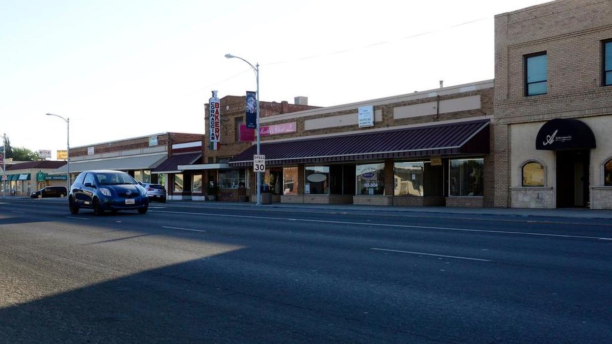 
A car heads east along Robertson Boulevard through Chowchilla’s downtown last month.
