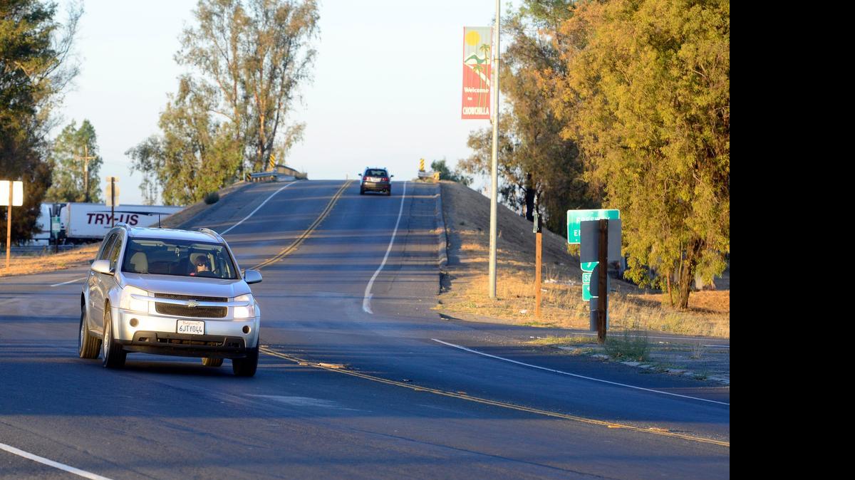 
Cars cross the bridge that sends traffic from Highway 233 in Chowchilla over Highway 99 on Tuesday. The city is considering options for improvements needed on that bridge, including one plan that would use roundabouts.
