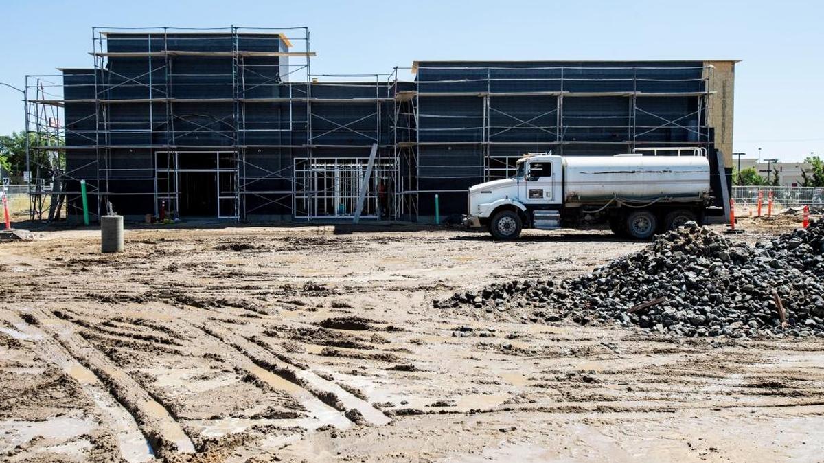 Construction work continues on a building at 16th Street and Martin Luther King Jr. Way in Merced on Thursday, June 30, 2016.