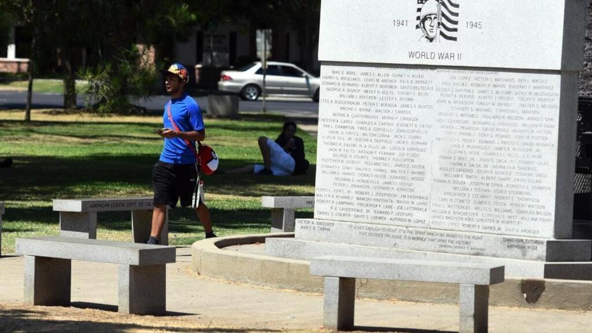 A Courthouse Park visitor walks by the Merced County Veterans Memorial on Tuesday, Aug. 2, 2016. Merced is looking to use the names of veterans to name streets as the city grows.