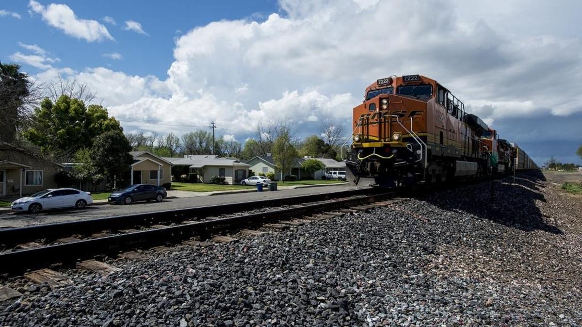 A freight train moves past residential homes toward U Street in Merced, Calif., on Tuesday, March 21, 2017. Merced City Council is considering adding quiet zones to the city’s northernmost railroad.