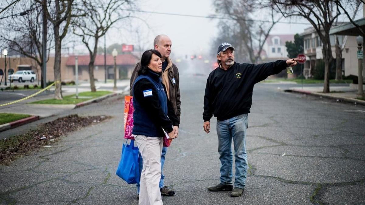 Merced City Manager Steve Carrigan, left rear, and Riggs Ambulance Service Community Relations Manager Sonya Severo stop to speak with Merced resident Dave Lillard, 56, right, who points toward an area where he saw homeless persons during the 2016 Merced City and County Continuum of Care Homeless Count in Merced on Thursday, Jan. 28, 2016. Approximately 150 volunteers walked the city to speak with the homeless and offer them a quarter-gallon bag containing snacks, socks and various hygiene products.