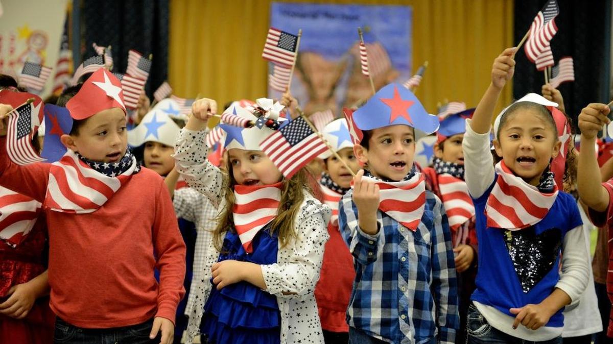 First-grade students at Dos Palos Elementary sing “Yankee Doodle” to local veterans Tuesday, Nov. 10, 2015.