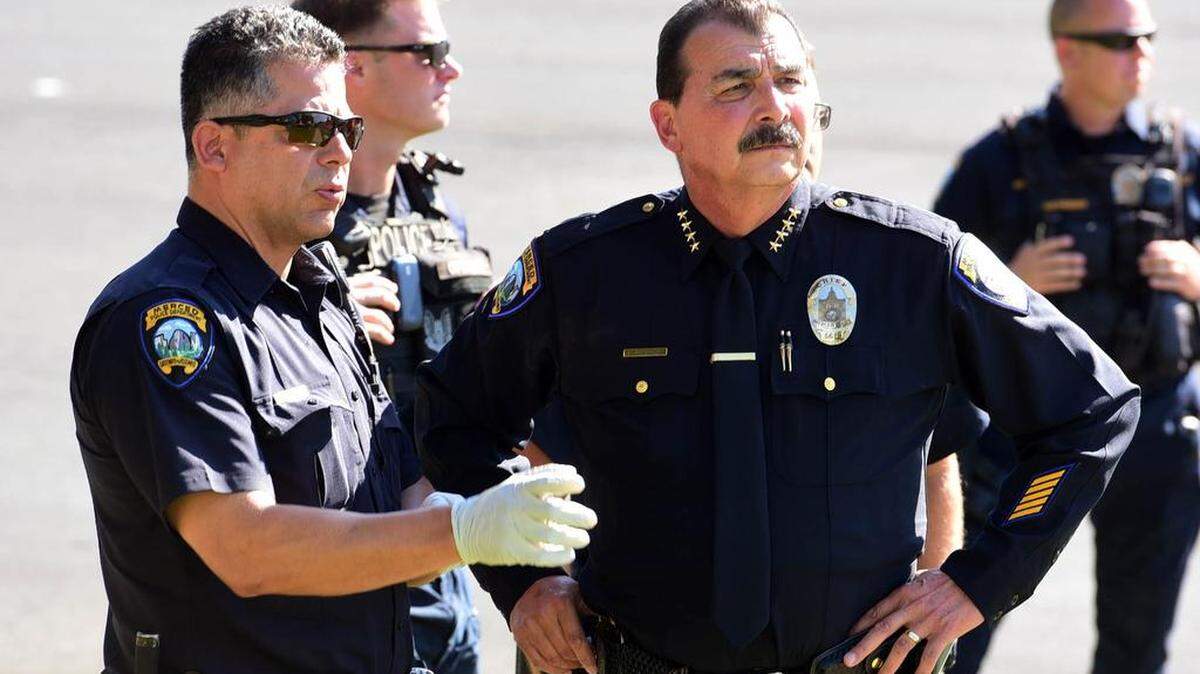 Merced Police Chief Norm Andrade, right, and officers purvey a UC Merced protest that started on campus and spilled onto city streets on Thursday, July 13, 2017. Andrade announced on Monday, Nov. 20, 2017, his intention to retire at the end of the year.