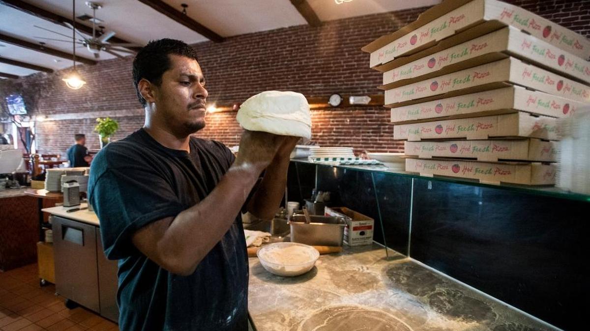 Bella Luna Bistro pizza chef Vincent Garcia, 32, of Merced, prepares pizza dough during the restaurant’s dinner hours in Merced, Calif., on Thursday, May 4, 2017.