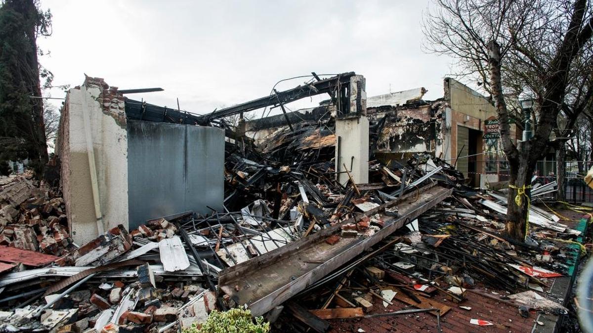The remains of an Asian market located in the 600 block of West Main Street in Merced, Calif., on Saturday, Dec. 31, 2016. The Market caught fire on Sunday, Dec. 18, 2016.