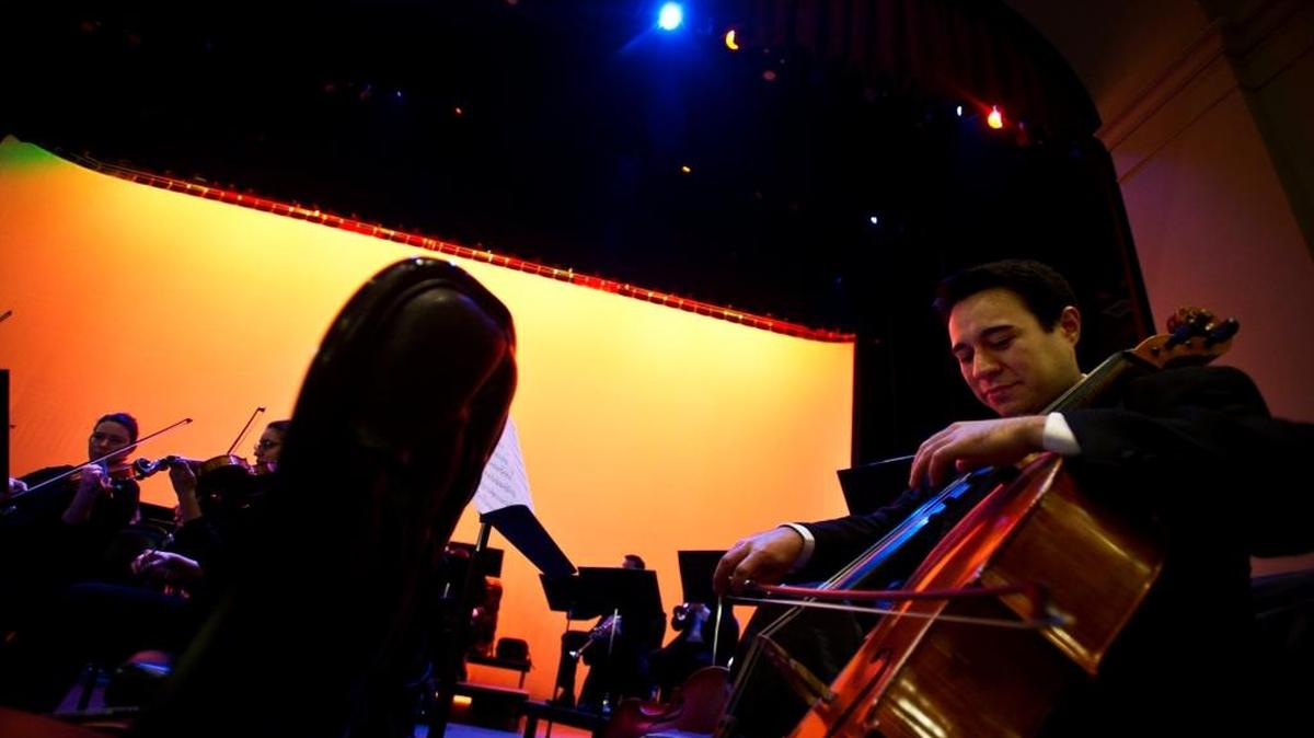 Cellist Gabriel Beistline prepares for the Merced Symphony’s Annual Pops Concert at the Merced Theatre in Merced, Calif., Friday, Jan. 30, 2015.