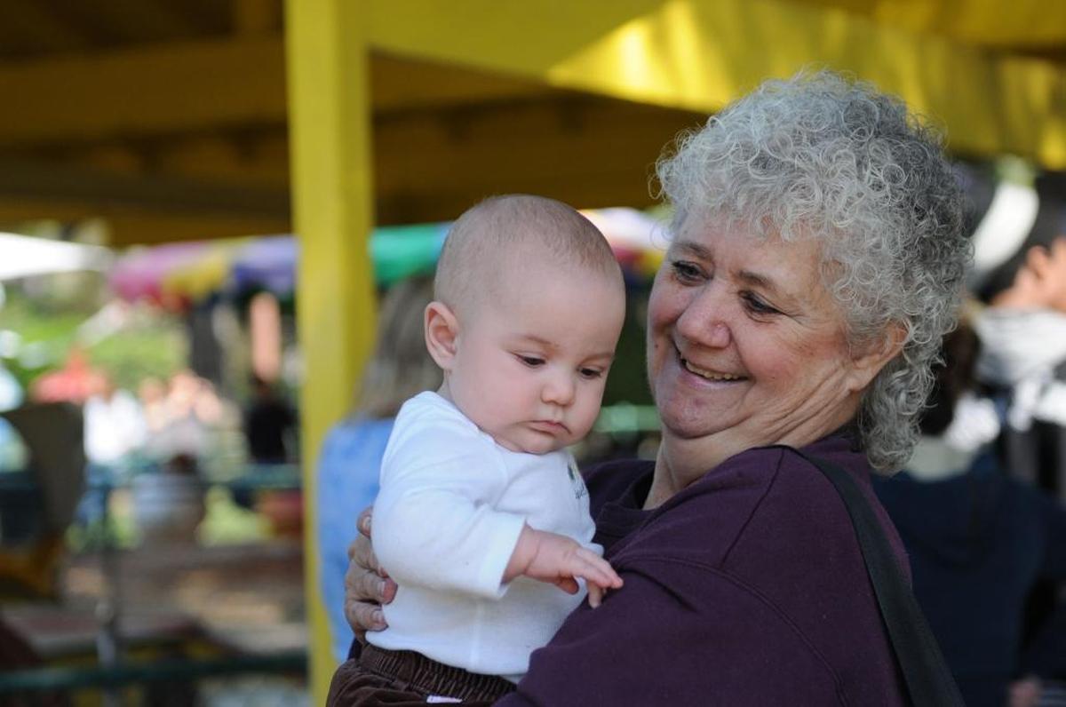Sun-Star photographer Marci Stenberg holds baby Sophia Bowers at the Kiwanis Kiddieland during the Kiwanis Club of Greater Merced annual Easter egg hunt at Applegate Park in Merced on April 7, 2012.