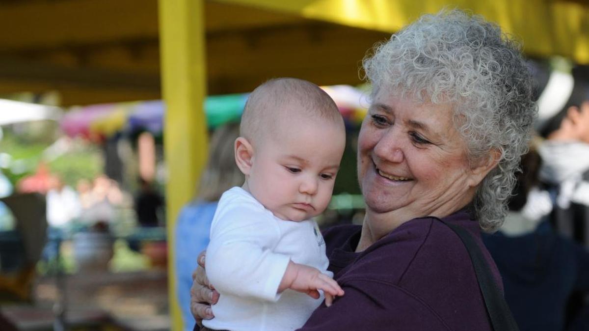 Sun-Star photographer Marci Stenberg holds baby Sophia Bowers at the Kiwanis Kiddieland during the Kiwanis Club of Greater Merced annual Easter egg hunt at Applegate Park in Merced on April 7, 2012.