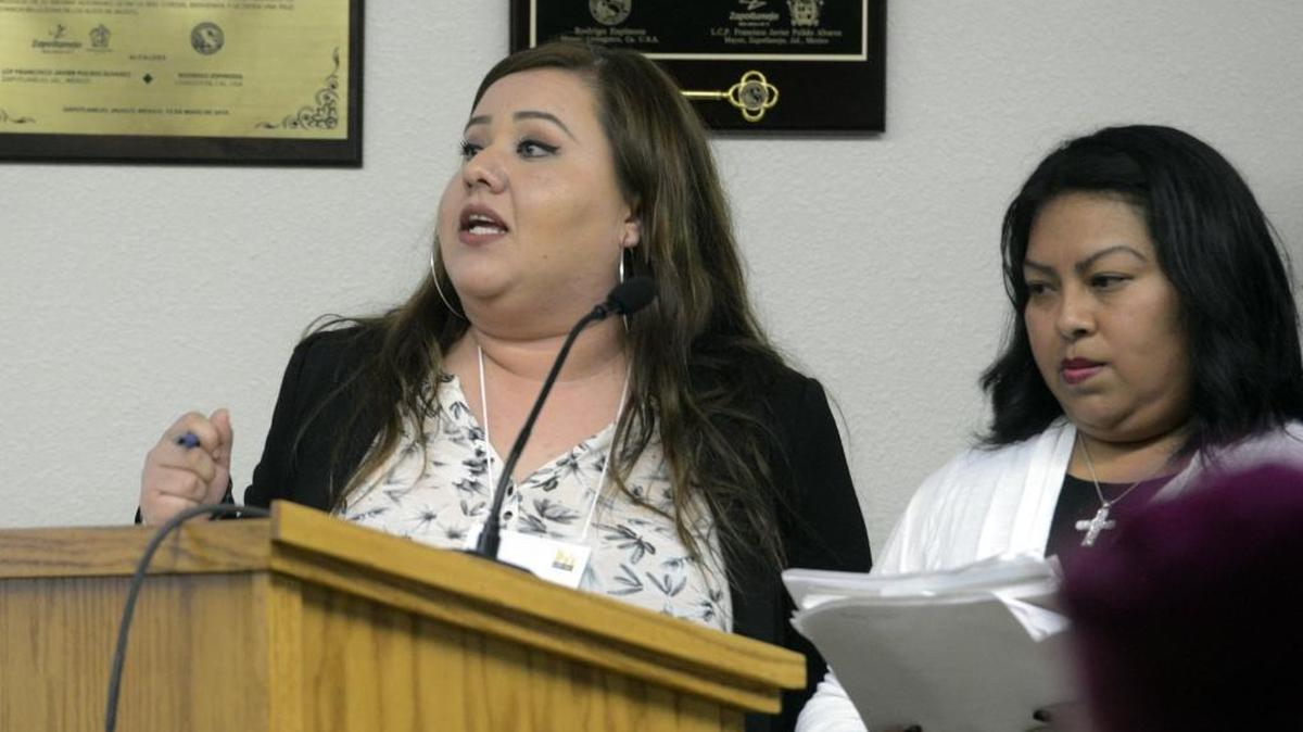 Crissy Gallardo, left, a community organizer with the Merced Organizing Project, translates for Floripes Dzib during a Livingston City Council meeting Tuesday.