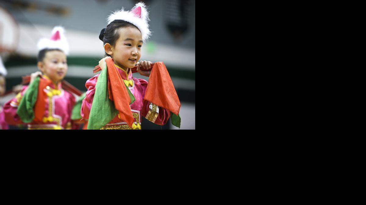 
Yuang Guo of Beijing Runfeng School performs during a ceremony at Livingston Middle School in Livingston on Thursday. About 50 students from China, in third through eighth grade, spent a few days with Livingston students during the first edition of a new exchange program.
