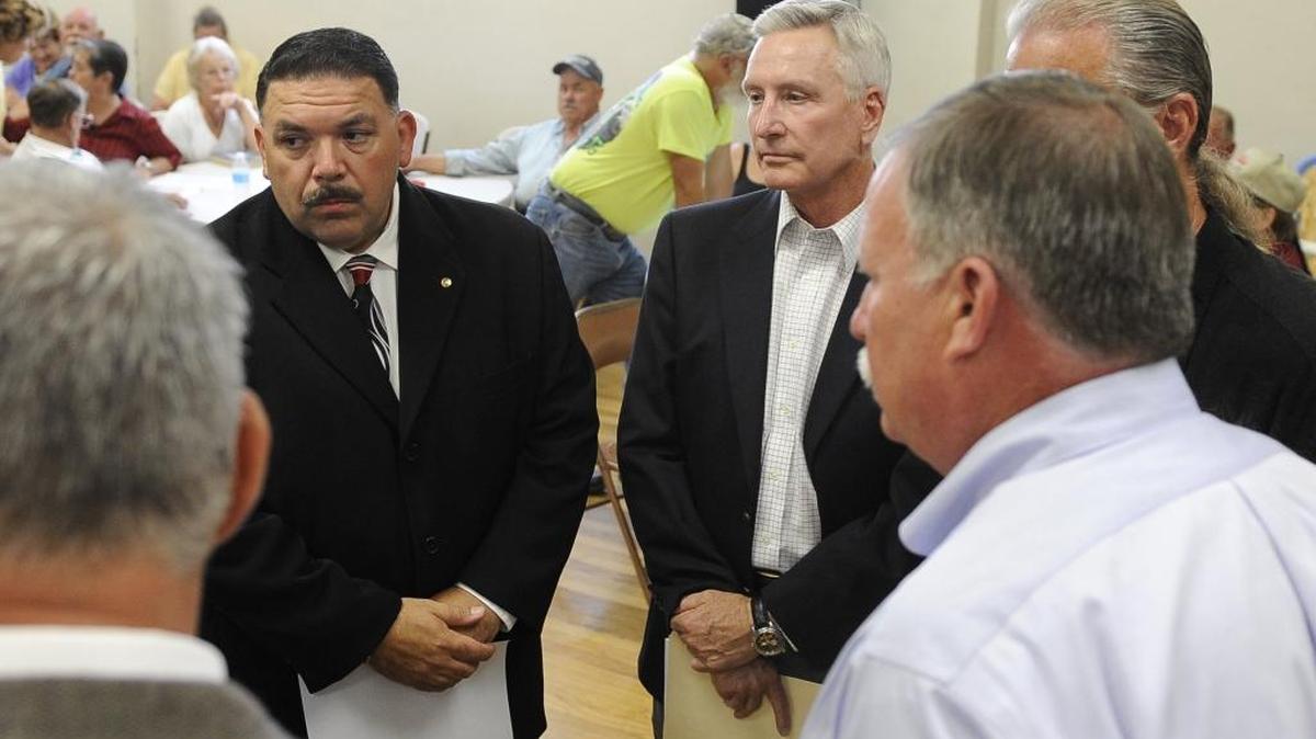 Merced County sheriff candidates Jim Soria, left, and Pat Lunney listen to instructions before a 2014 debate in Atwater.