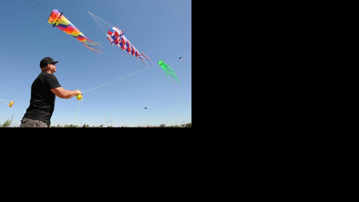 
Rob Macias, 51 of Merced flies a green octopus kite amidst his wind sock kites at the Livingston Kite Festival in 2013 at Livingston Middle School.
