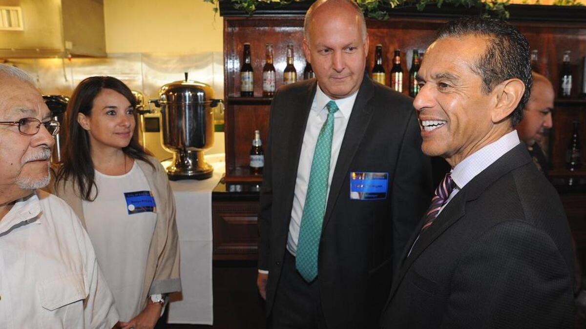 
Antonio Villaraigosa, right, chats with, from left, Baldo Salcido, city of Los Banos Finance Director Sonya Williams and Los Banos City Manager Steve Carrigan on Thursday morning prior to breakfast in Los Banos.

