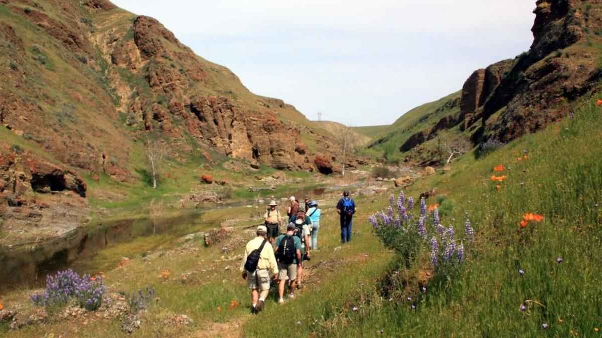 Hikers travel the Path of the Padres outside Los Banos.