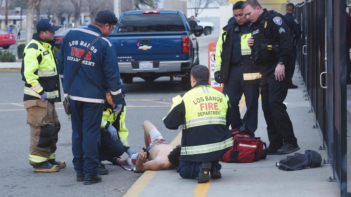Emergency personnel tend to a 17-year-old shooting victim in front of Miano Elementary School in Los Banos Monday, Jan. 29, 2018.