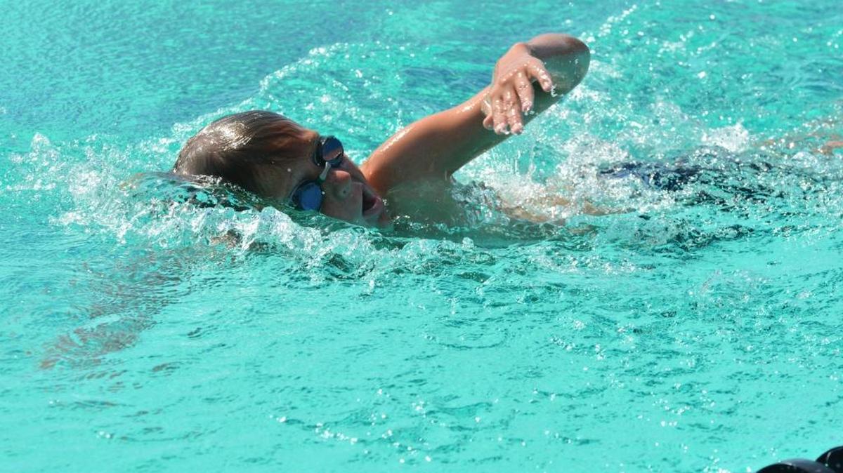 Mercey Springs fourth-grader James Savage prepares for a record-breaking swim by practicing his freestyle stroke Wednesday, June 1, 2016, at the Pacheco High School pool.