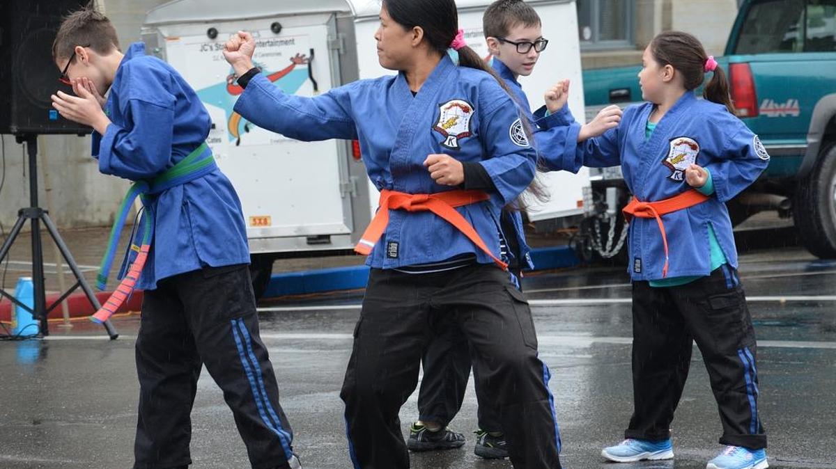 Members of the Castellanos Kenpo Karate club perform at the Spring Street Faire on Sixth Street on Saturday, April 9, 2016, in Los Banos.