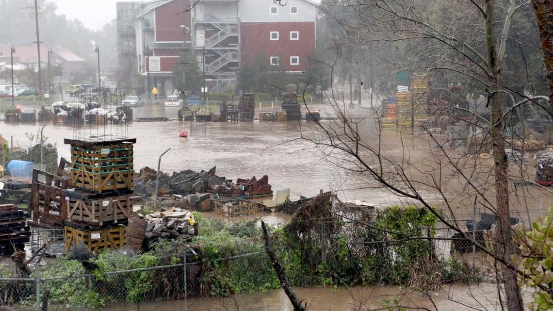 Water from the San Lorenzo River inundates the yard at Central Home Supply near the Tannery Arts Center in Santa Cruz, Calif., Tuesday afternoon, Feb. 7, 2017. Residents were evacuated as the water rose Tuesday morning when the river flooded Felton Grove and the surrounding neighborhood.