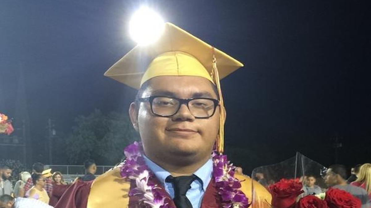Edgar Martinez poses for a photo after his graduation ceremony from Los Banos High School June 3, 2016.