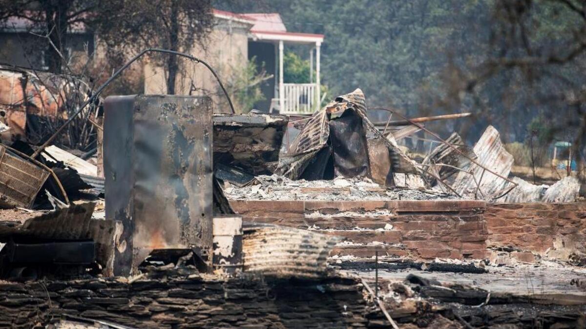 A home destroyed but the Detwiler fire is seen along Mount Bullion Cutoff Road in Mariposa County, Calif., on Thursday, July 20, 2017.