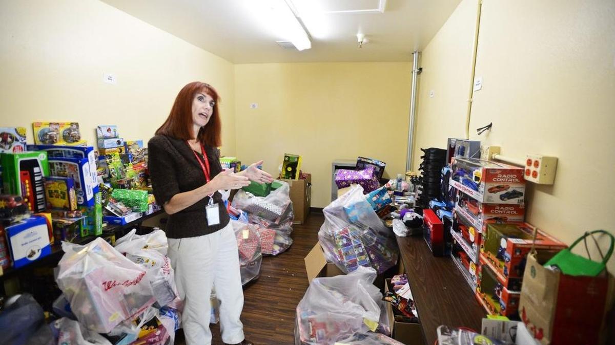 CJ Jones of the Merced County Human Services Agency, speaks about toy donations at the Merced County Human Services building located at 2115 Wardrobe Avenue in Merced, Calif., Tuesday, Dec. 23, 2014. A toy drive is set for this weekend.