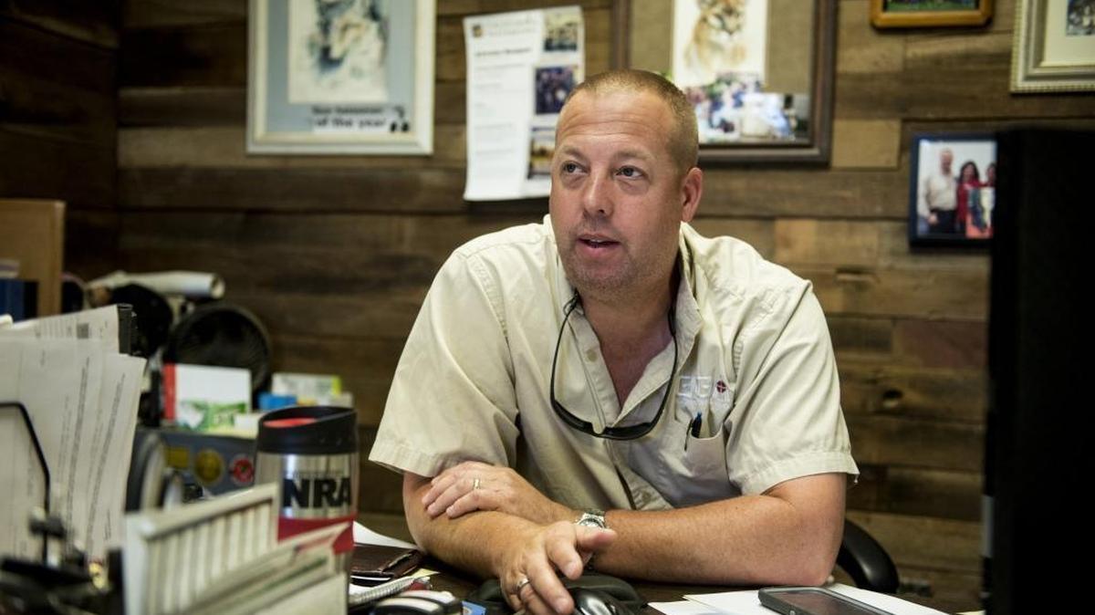 Blair Gladwin, owner of Gladwin Guns and Ammo, located at 6493 E. Olive Ave., speaks about his lawsuit against money transfer services that refuse to open accounts with his business, in Merced, Calif., on Tuesday, June 27, 2017. Gladwin is suing money transfer services PayPal, Stipe and Square alleging discrimination against his business which sells firearms as a licensed retailer by the federal government.