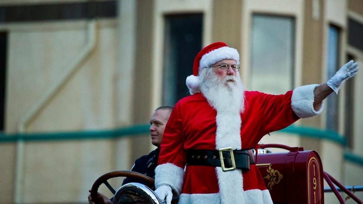 Santa Claus waves to the crowd during last year’s Merced Hometown Christmas Parade. This year’s parade starts at 3 p.m. Saturday.