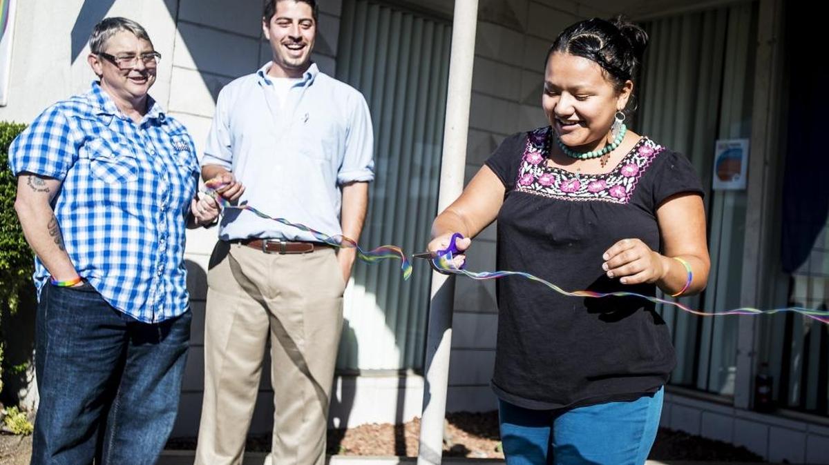 
Board member Jazz Diaz of Merced cuts the ribbon during a rainbow-ribbon-cutting ceremony to celebrate the reopening of the Merced LGBT Community Center in Merced on Saturday, Oct. 3, 2015.

