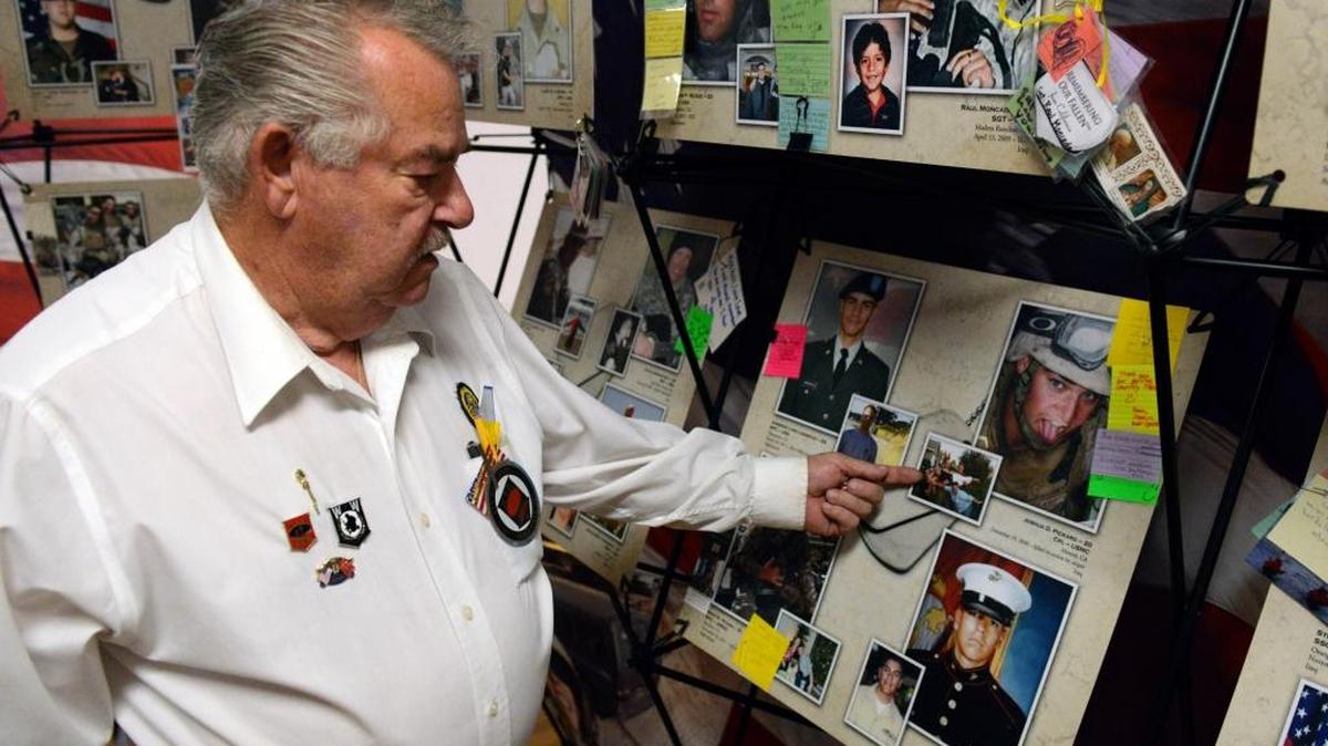 
Roy Hart, 77, a member of the Dos Palos American Legion, points to a photo of Cpl. Joshua Pickard, who was killed in Iraq in 2006, in the American Legion Hall in Dos Palos on Saturday, Oct. 10, 2015. The “Remembering Our Fallen” exhibit, featuring the 722 Californians killed since Sept. 11, 2001, is open daily in Dos Palos this week.
