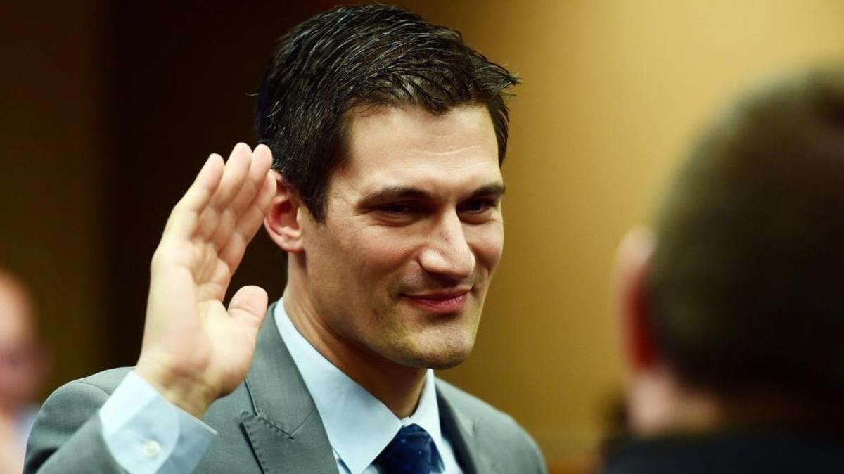 Councilman Matt Serratto takes the oath of office on Monday in the Merced City Council chambers.