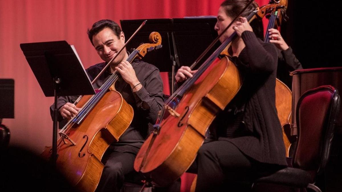 Cellists with the Merced Symphony perform with San Francisco-based violinist Dawn Harms for more than 1,000 Merced-area students at the Merced Theatre in 2017