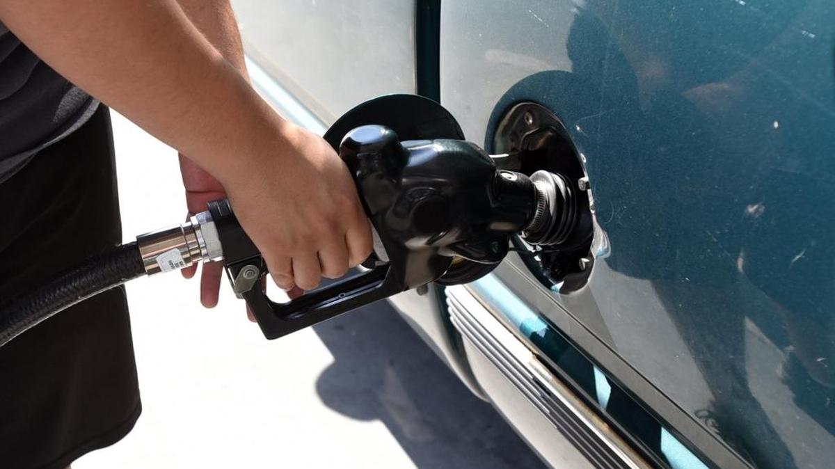 A Merced man pumps gas at Valero station on G Street on Monday, May 2, 2016.