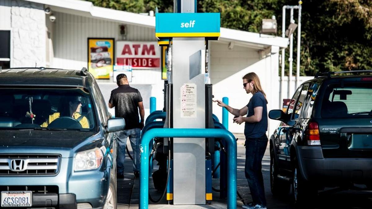 Motorists fill up at the Valero gas station at the intersection of G Street and East Alexander Avenue in Merced, Calif., Tuesday, Feb. 9, 2016.