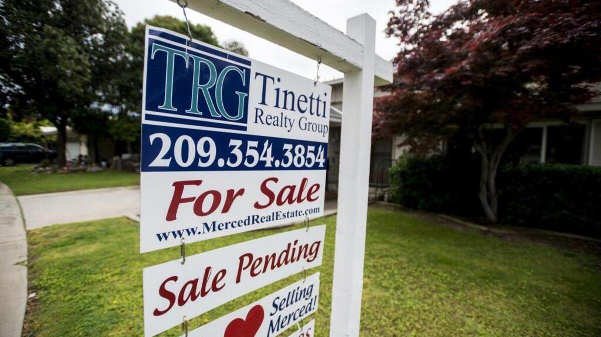 A sign sits in the front yard of a house for sale in the 300 block of West Alexander Avenue in Merced, Calif., on Thursday, April, 13, 2017.