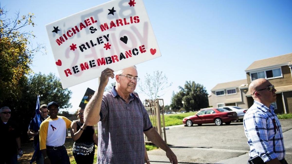 Ed Rodgers, 67, of Merced holds a sign during the annual Riley Brothers Victims’ Remembrance Walk in Merced, Calif., on Saturday, Oct. 8, 2016. The walk, which is named for Mike and Marlis Riley, brothers who where killed less than a year apart, gives Merced-area families a chance to mourn loved ones lost to violence. Rodgers was a neighbor of Mike and Marlis Riley.