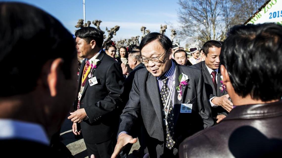 Chong Vang shakes hands with guests during the Hmong New Year celebration at the Merced County Fairgrounds last year.
