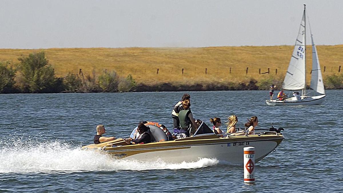Families boat at Lake Yosemite on Aug. 23, 2008.