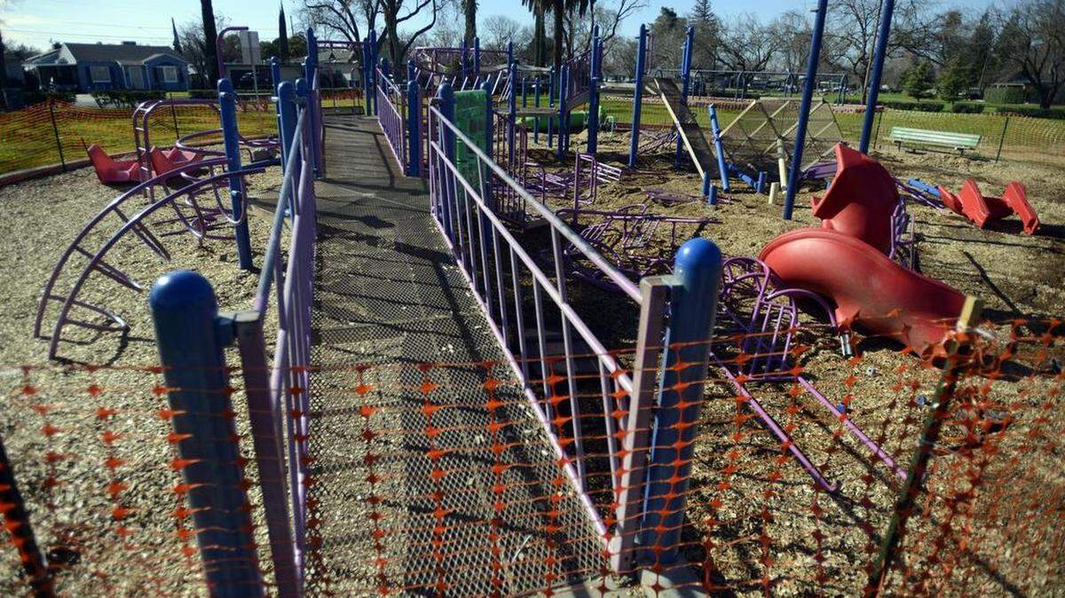 The playground equipment on the western end of Applegate Park is fenced off on Friday, Jan. 19, 2018, because the decades old structure was found to be unsafe, according to Merced city staffers.