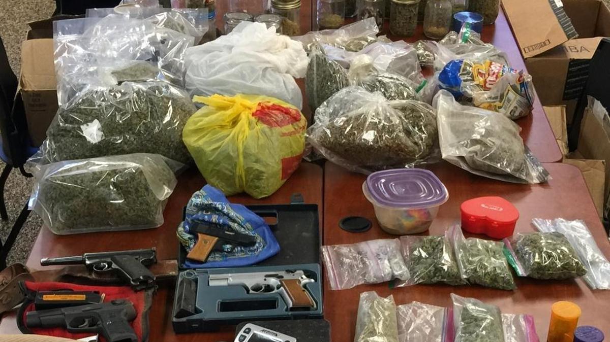 
Marijuana, cash and guns were collected during a search of four homes in Mariposa County on Thursday. 
