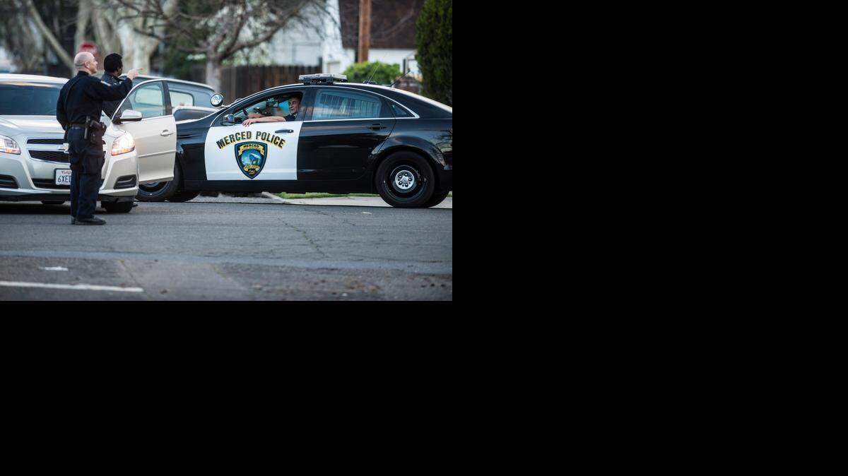 
Merced police close the intersection of I Street and West 21st Street while searching for a suspect after an officer was shot Feb. 28.
