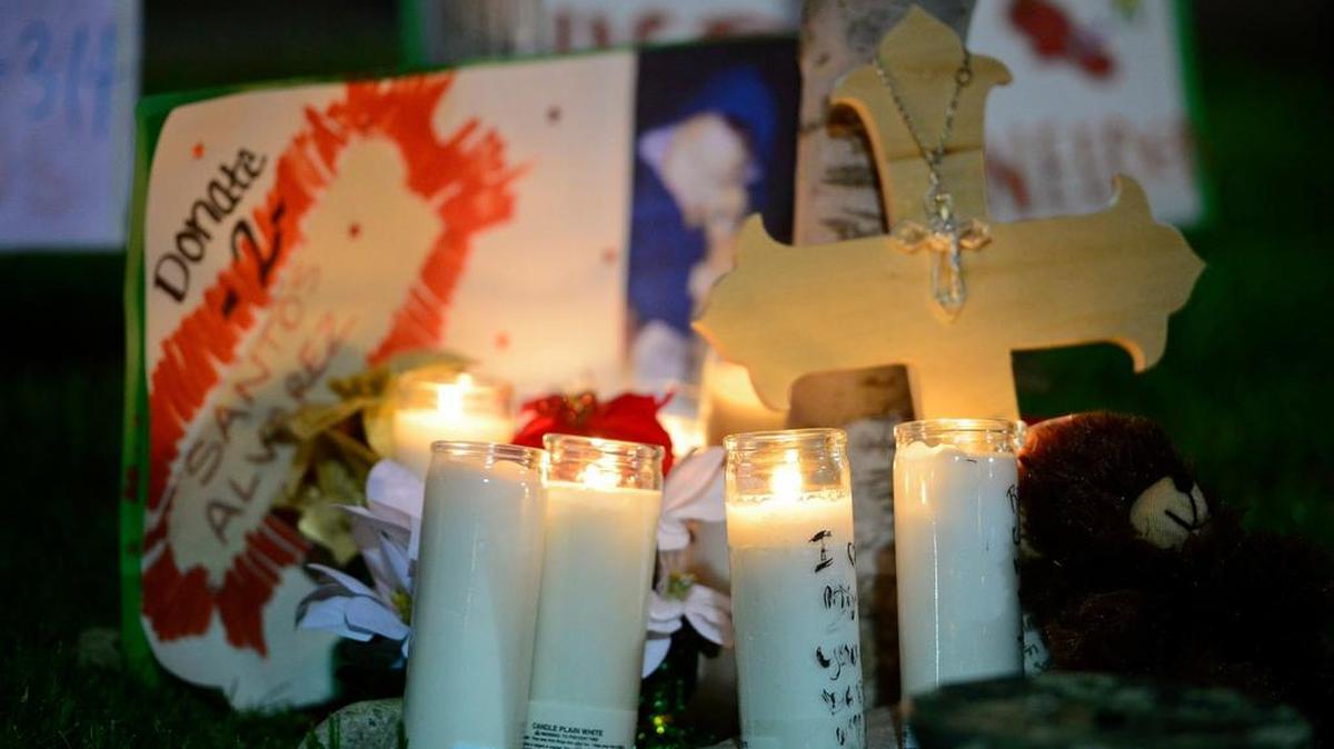 
Candles are placed near a tree during a candlelight vigil held for three-year-old Santos Alvarez at McDonald's restaurant located at 1060 W. 13th St. in Merced, Calif., Thursday, Nov. 6, 2014. According to authorities, Alvarez was reportedly killed after he was struck by a car on Monday, Nov. 3, 2014.
