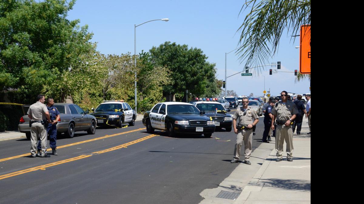 
Authorities respond to the scene where an Atwater police officer shot and killed a suspect involved in a domestic-violence-related kidnapping near Green Sands Avenue and Augusta Lane in Atwater on Monday.
