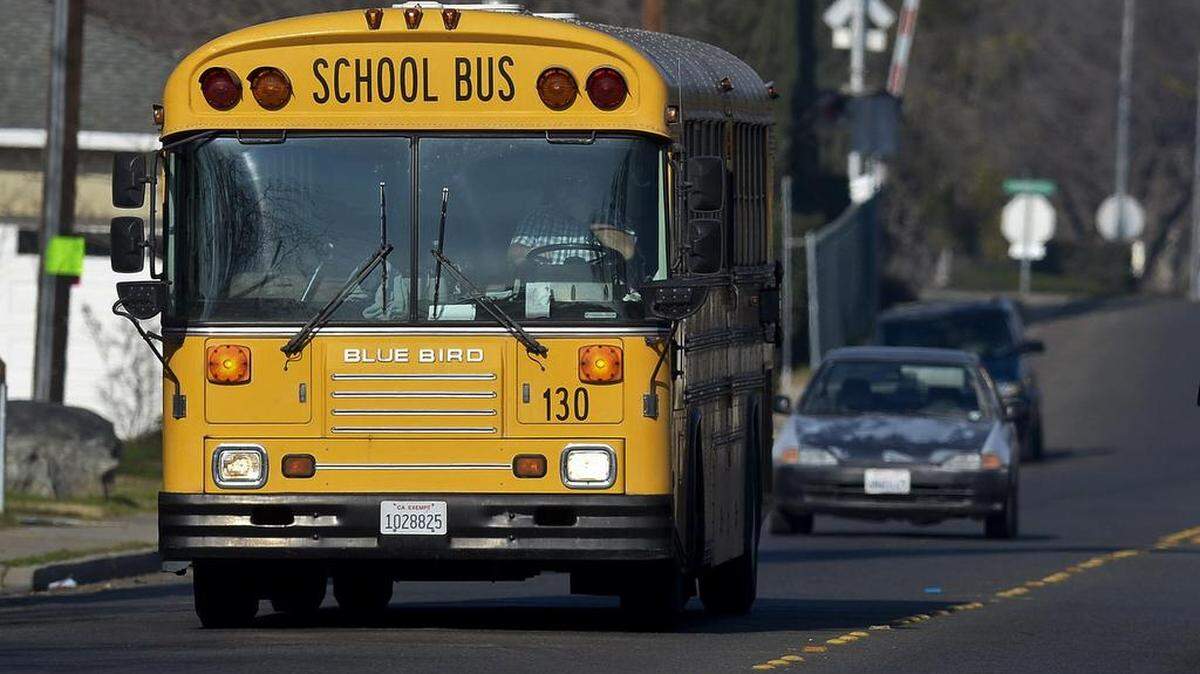 A school bus drives along Glenn Avenue in Merced, Calif., Thursday, Jan. 29, 2015. The Merced City School District board chose new boundaries for elementary schools on Tuesday.