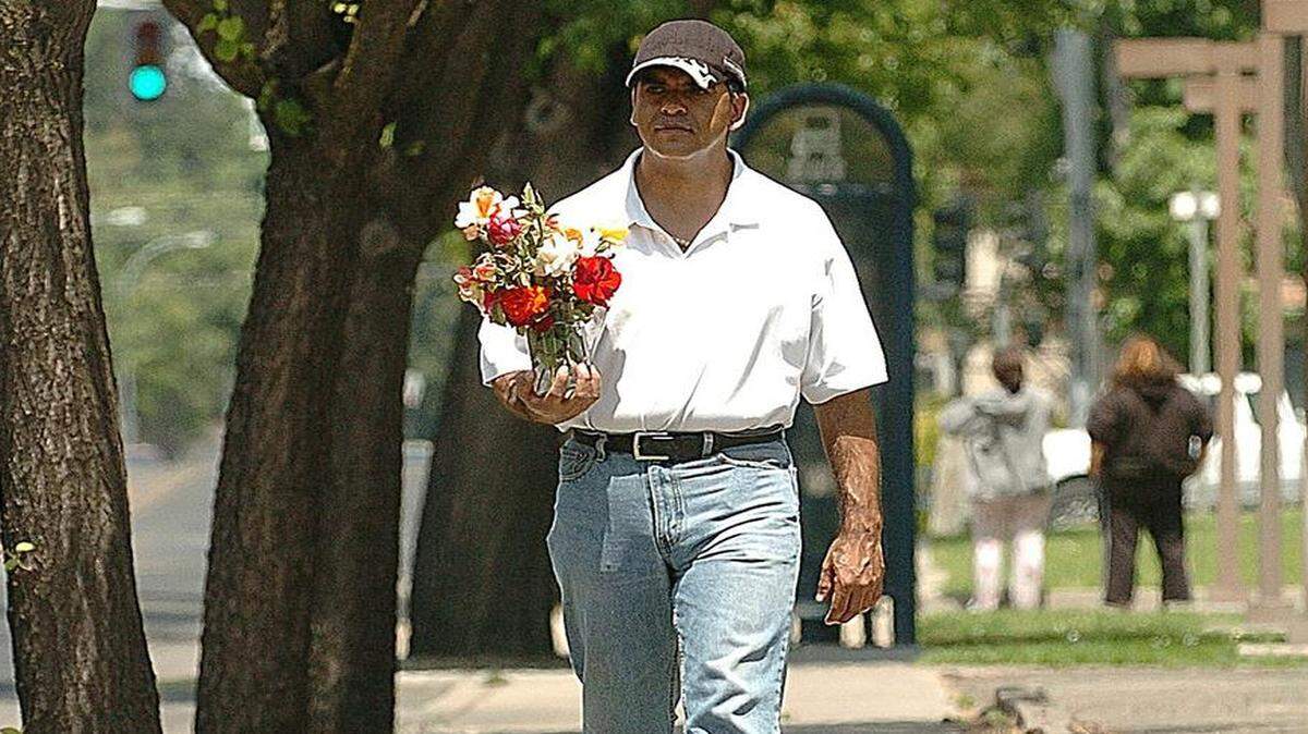 
On May 12, 2008, about four years before he was gunned down, Raymond Garza appeared in a Sun-Star photograph taking flowers to his mother’s grave. 


