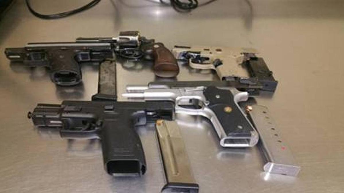 Officers seized five loaded firearms and arrested 20 people, including three juveniles, at a house party Friday night in the 1900 block of Almond Street in Merced.