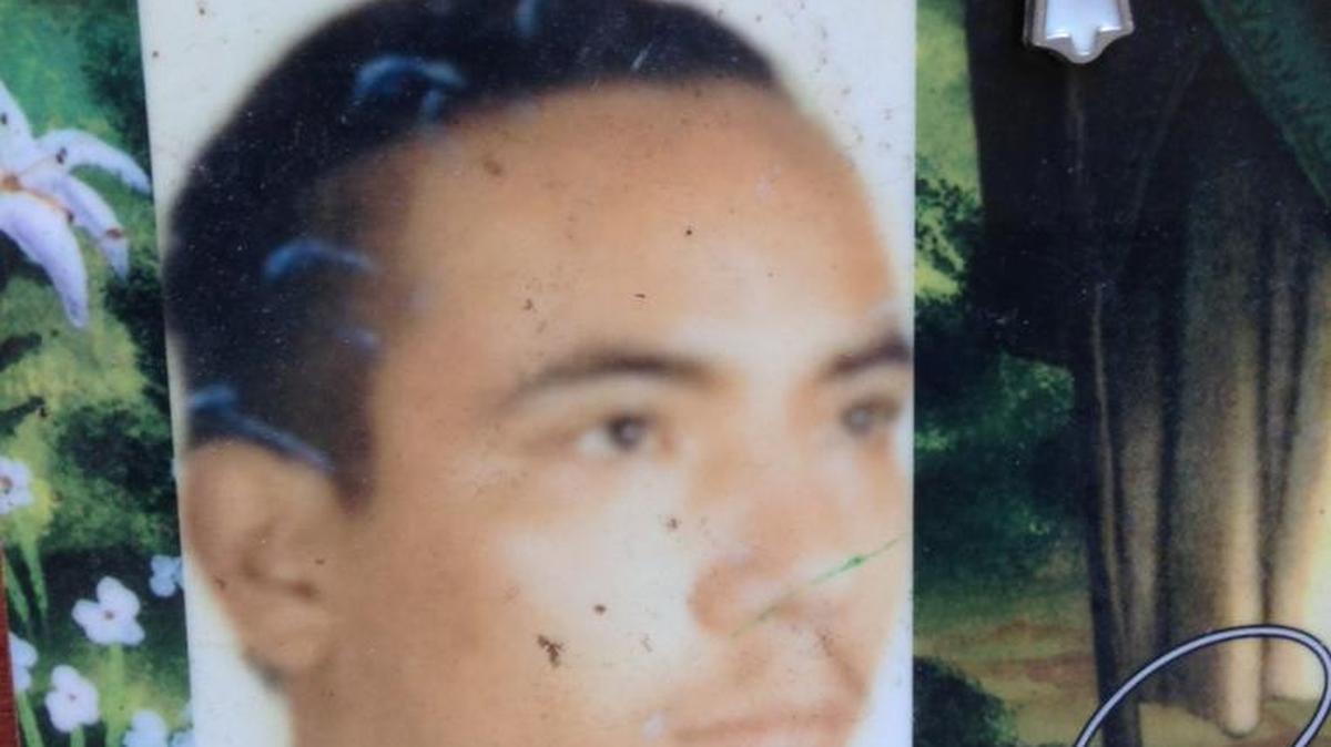 A photo of Juan Manuel Torres is displayed as a memorial marking the spot outside the family’s front door in Delhi where he was killed on Thursday, Sept. 8, 2016, after opening fire on sheriff’s deputies.