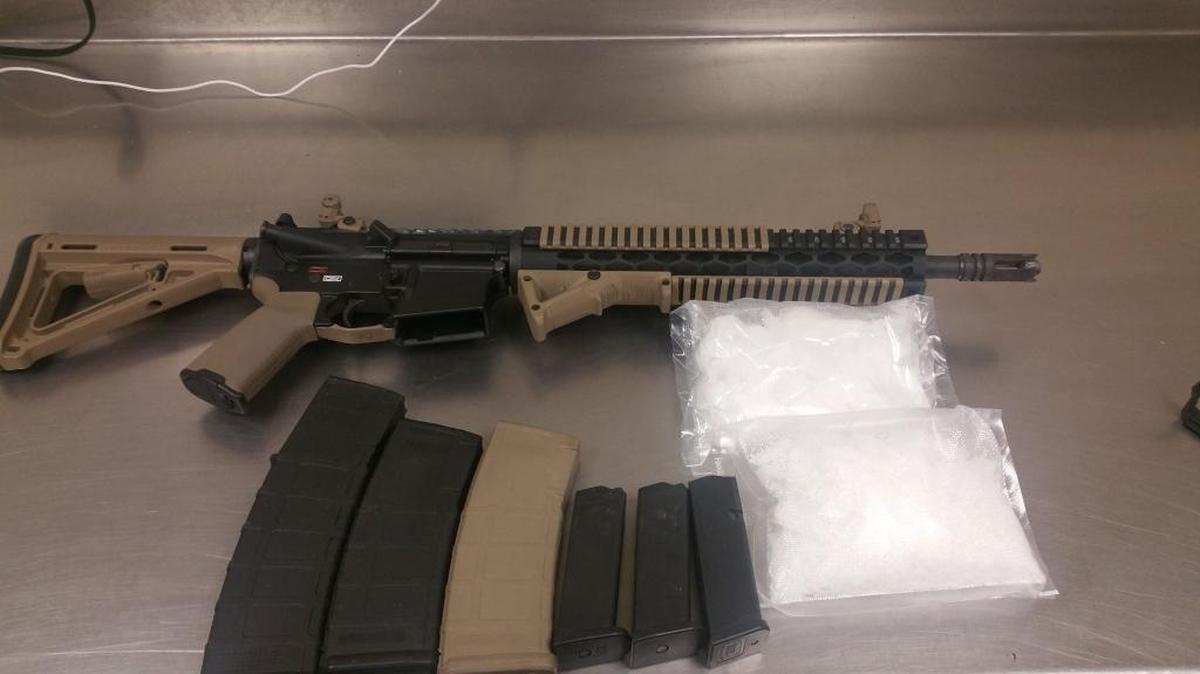 Investigators seized an AR-15 rifle Tuesday, along with more than a pound of suspected methamphetamine and five grams of cocaine, according to a statement from the Merced Police Department.