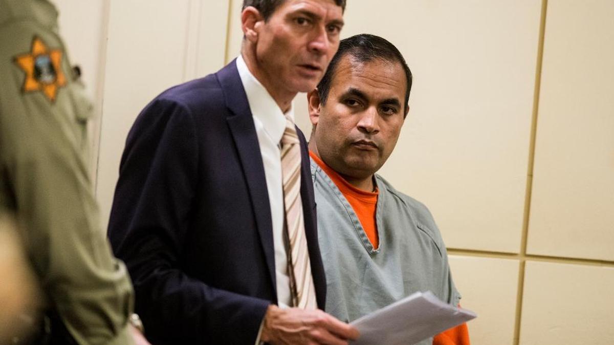 Lawrence Romero Ramirez, 47, of Merced, right, appears with Merced County Public Defender, Sean Howard, left, before Judge Jeanne Schechter at the Merced County Courthouse for sentencing, in Merced, Calif., on Thursday, Nov. 16, 2017. Ramirez was sentenced to more than four years in prison on child pornography charges.