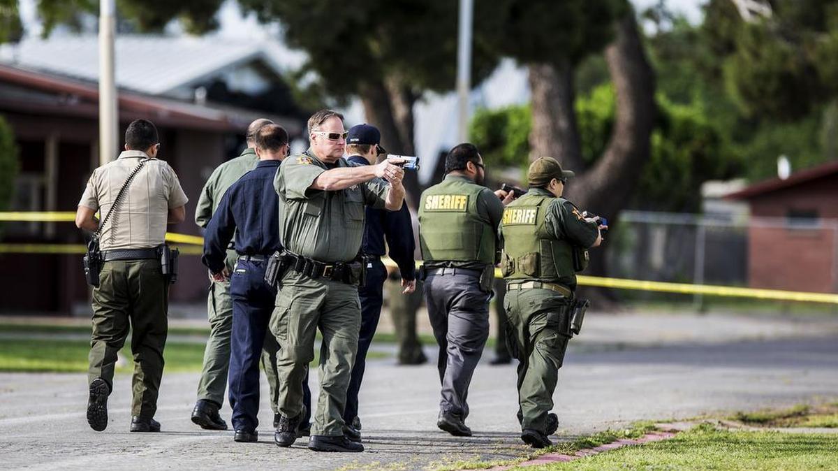 Merced County Sheriff's Deputy Mark Taylor looks for suspects during an active shooter training exercise at the Merced County Fairgrounds in Merced, Calif., Tuesday, April 12, 2016. Police agencies from Merced, Atwater, Livingston and UC Merced took part in the training along with the Merced County Sheriff's Department, the California Highway Patrol, Merced County Probation, Riggs Ambulance Service, the California Department of Forestry and Fire Protection, Merced County and the Merced Fire Department.